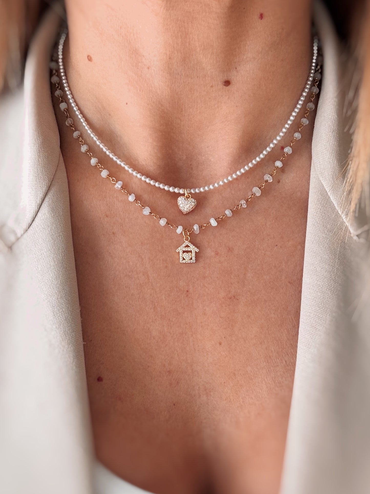 Collana cristalli bianchi e casetta