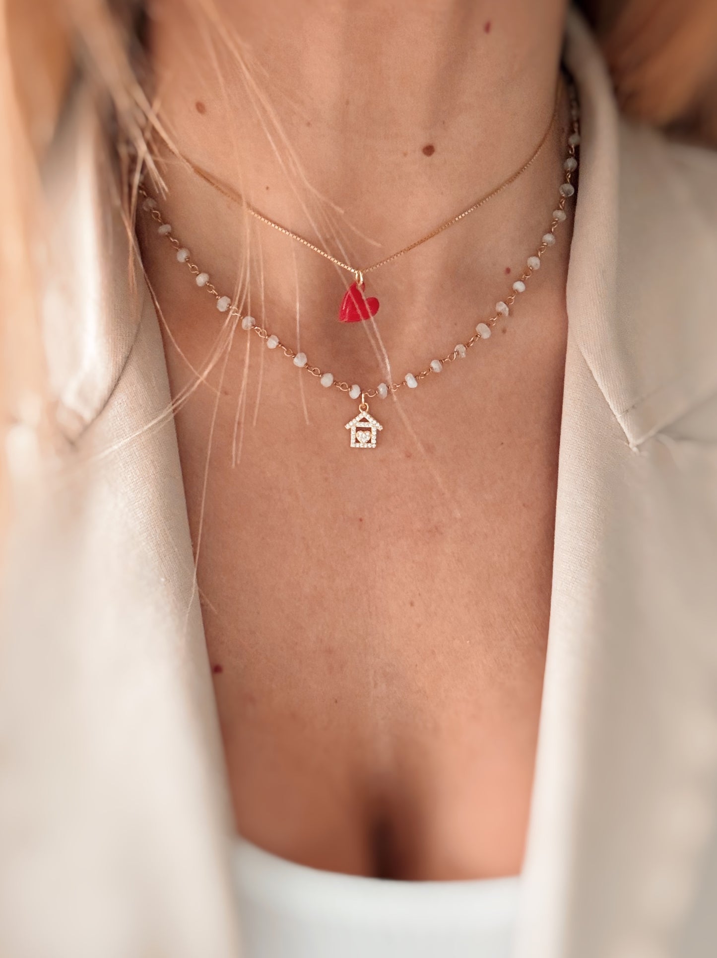 Collana cristalli bianchi e casetta