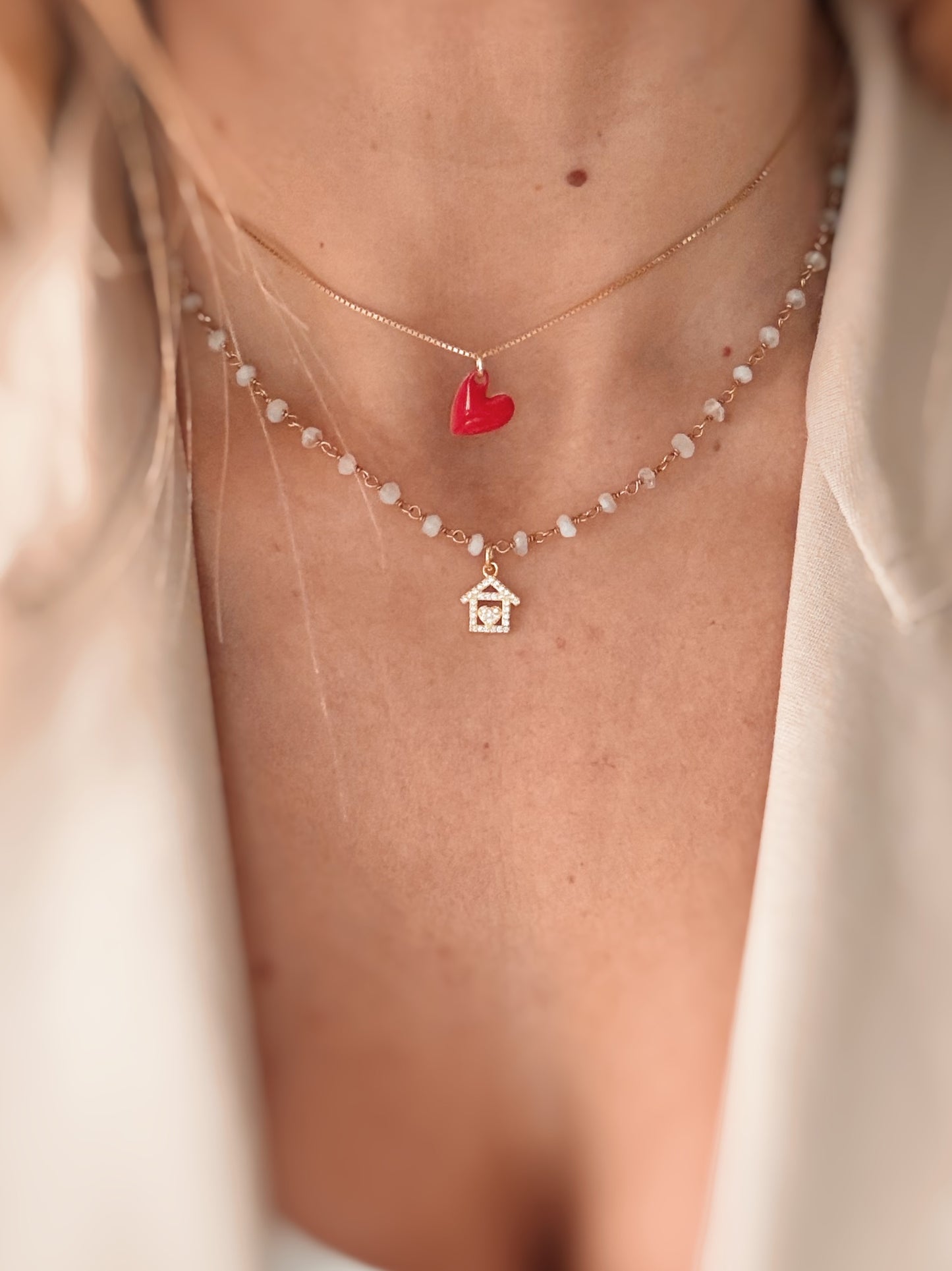Collana cristalli bianchi e casetta