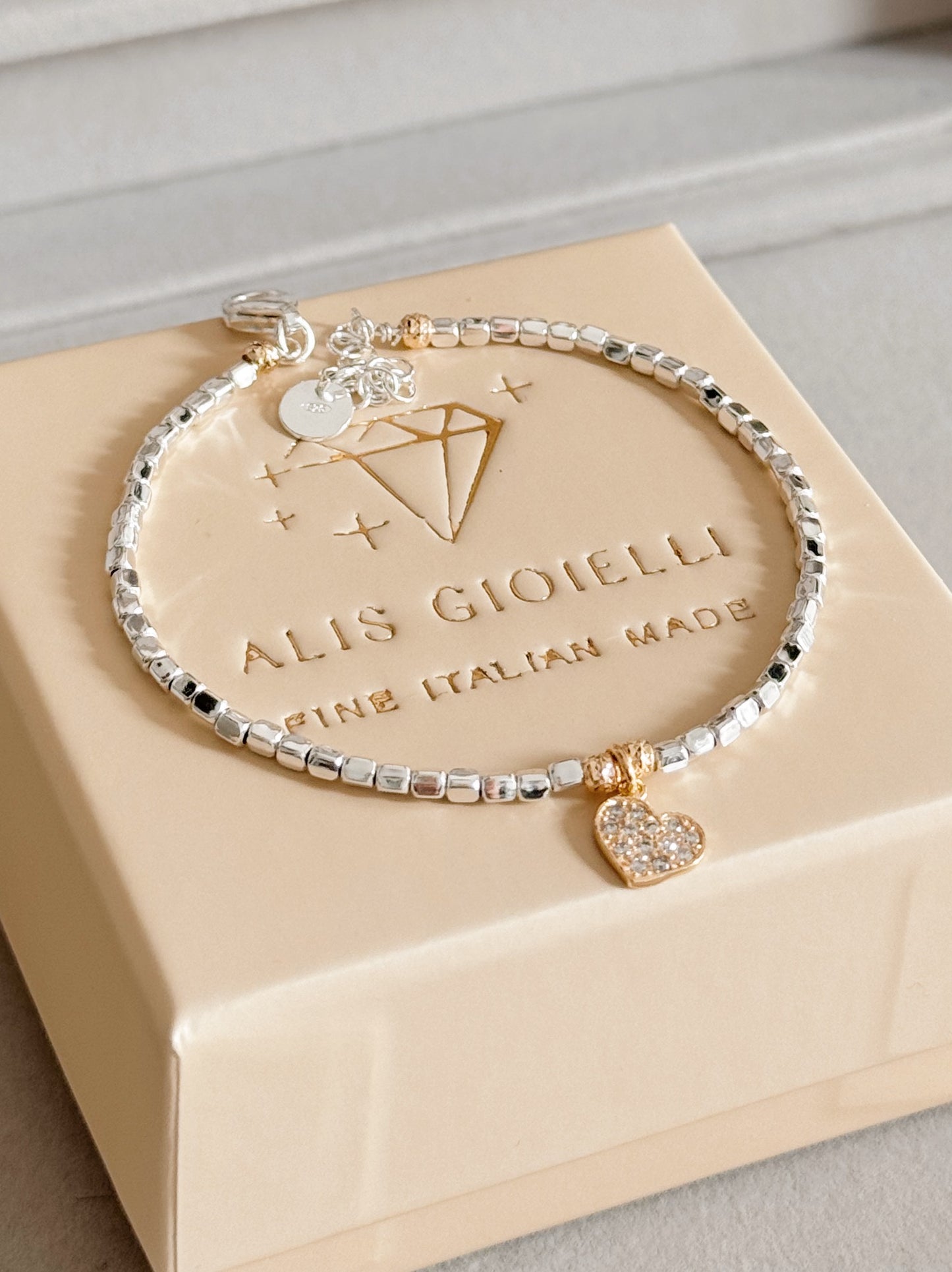 Bracciale cubetti e charm in zirconi