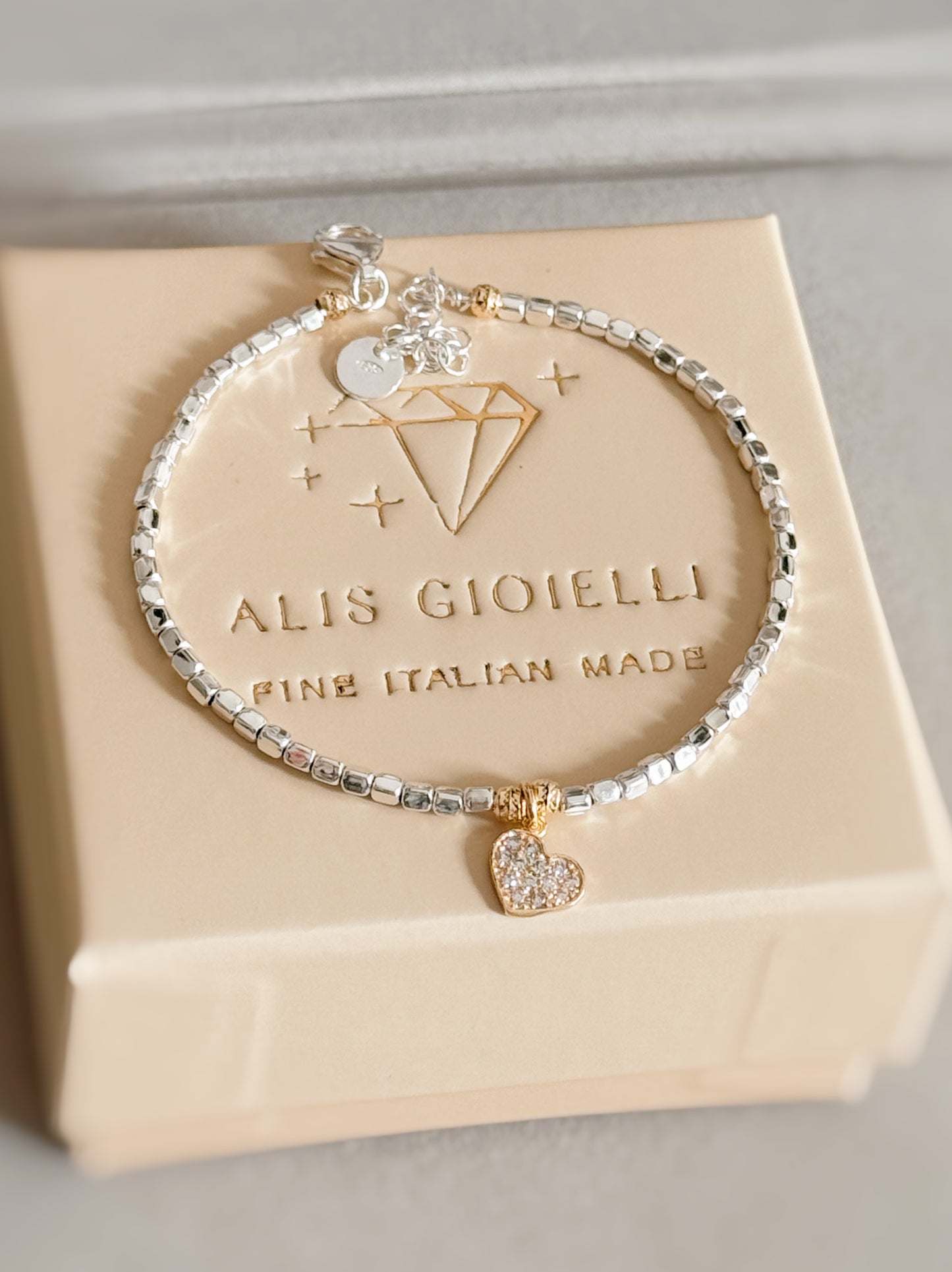 Bracciale cubetti e charm in zirconi