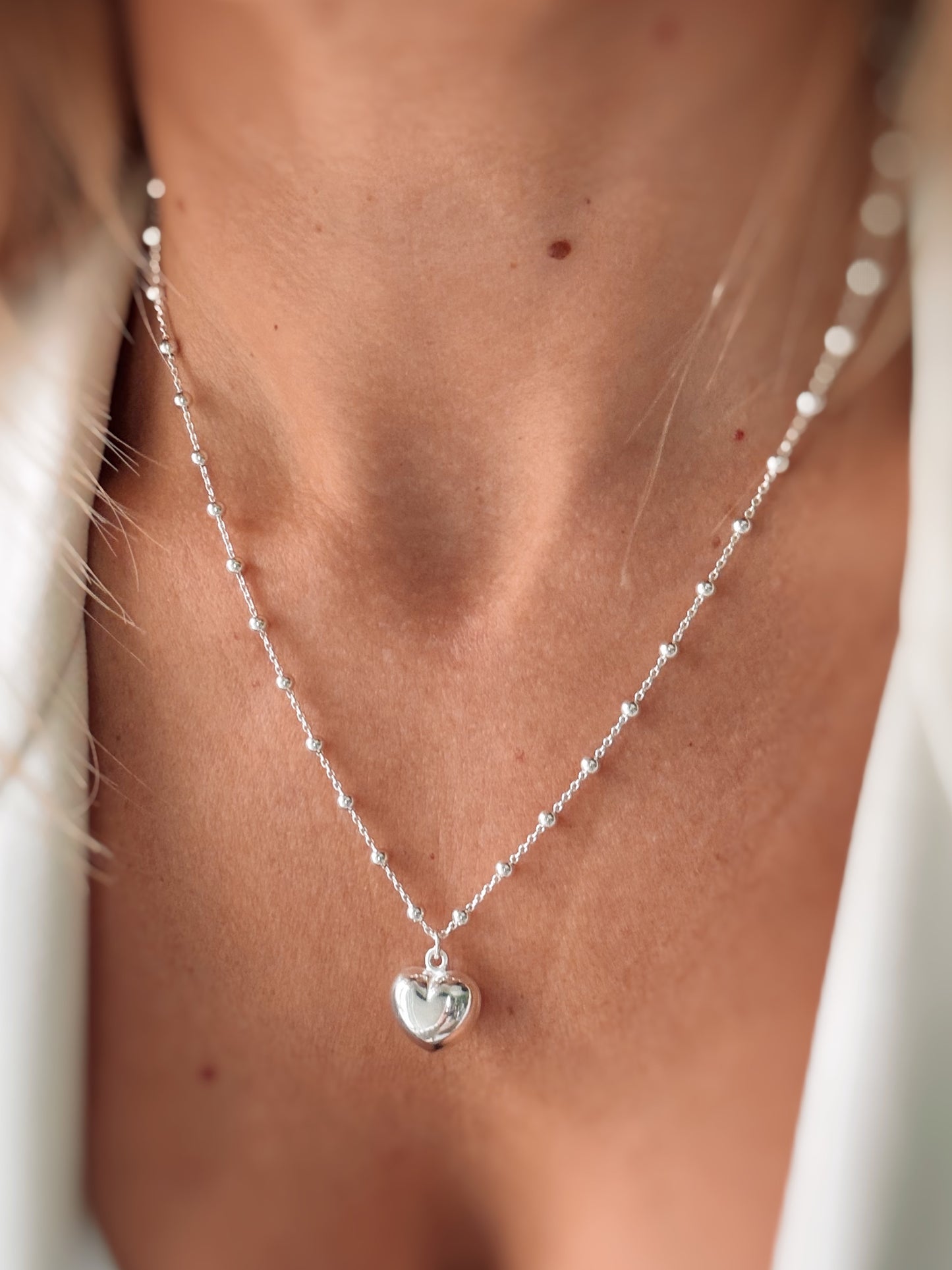 Collana cuore o stella (argento bianco)