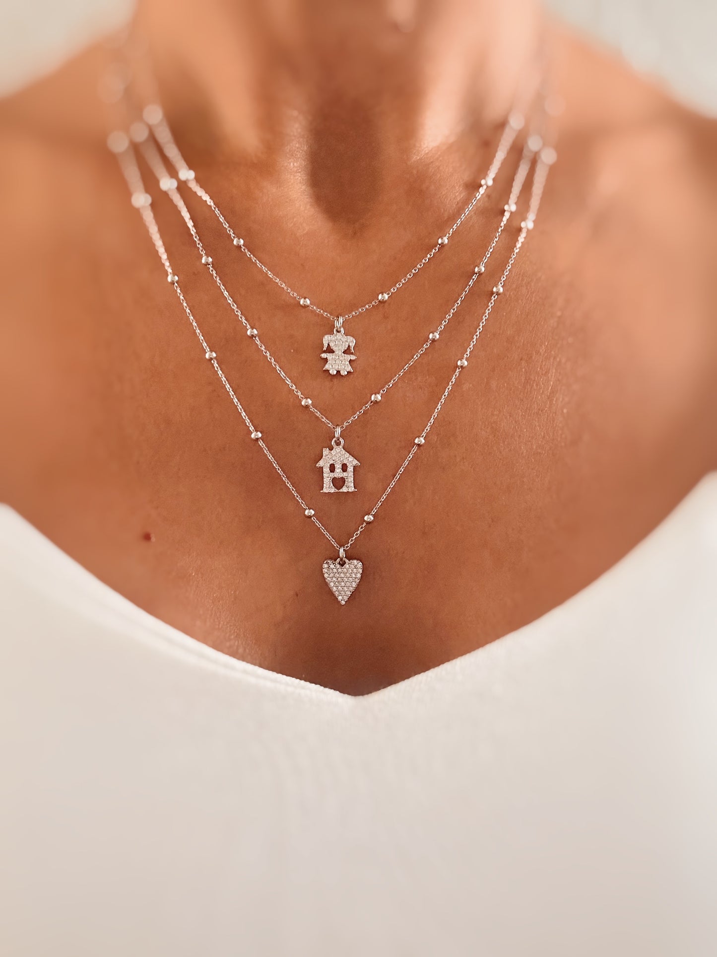 Collana con ciondolo mini cuore a punta e zirconi