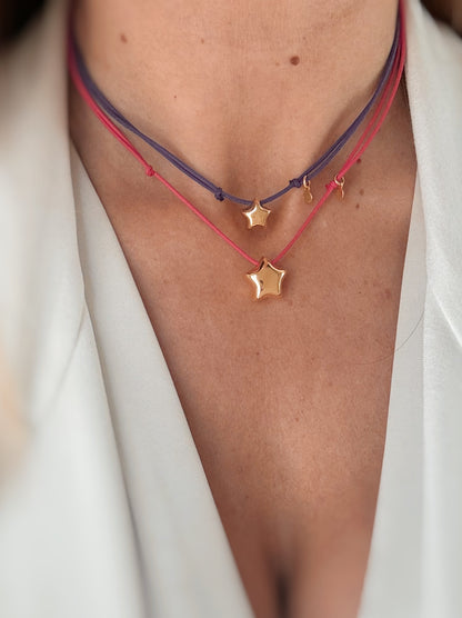 Collana chocker con stellina bombata.