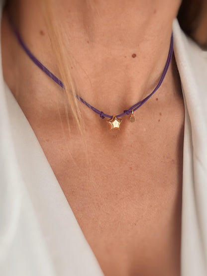 Collana chocker con stellina bombata.