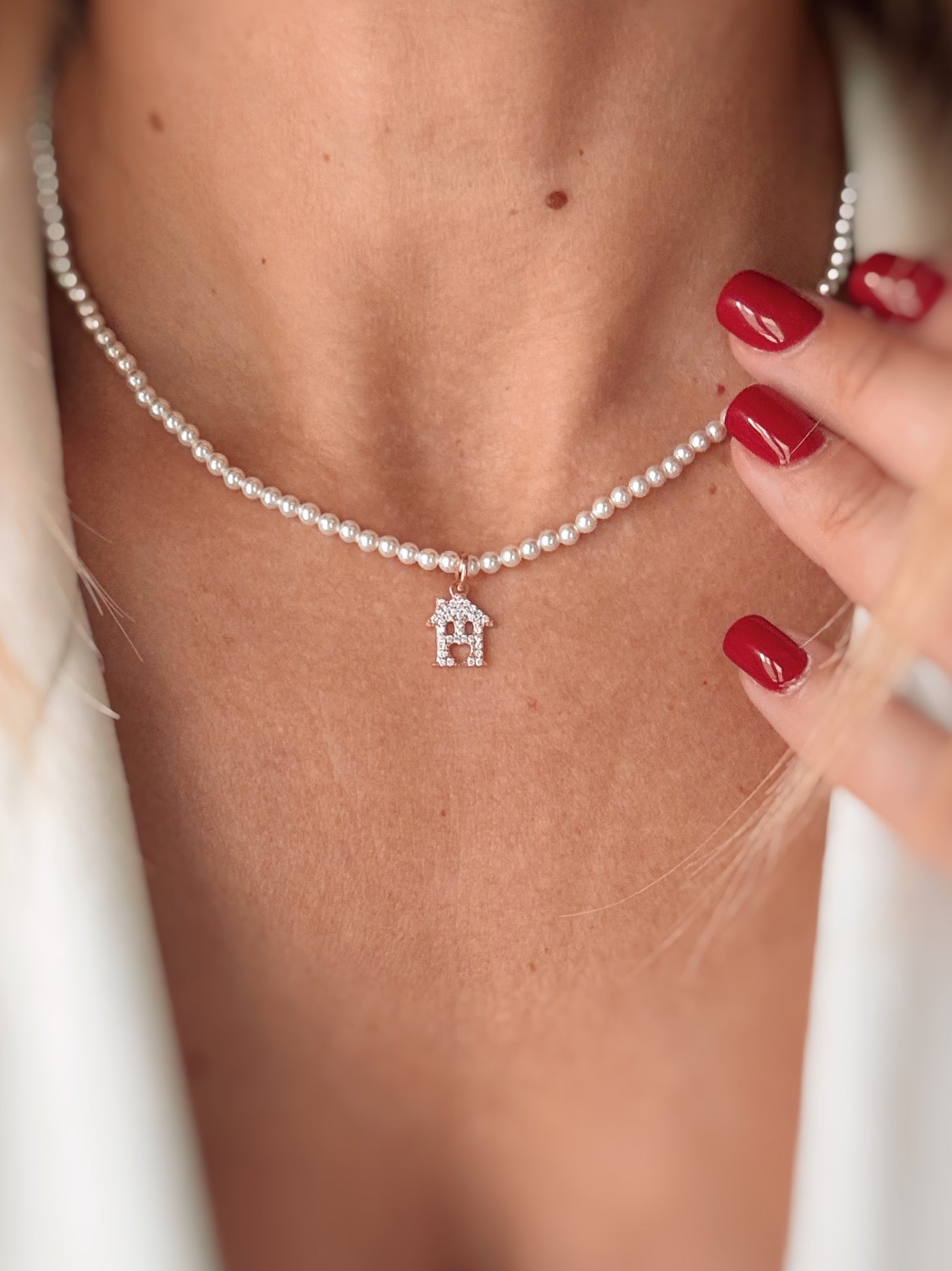 Collana perle e casetta