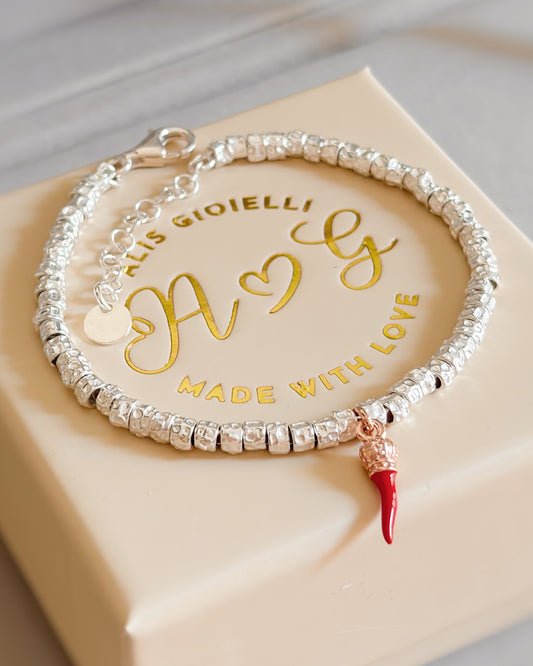 Bracciale granelli e corno