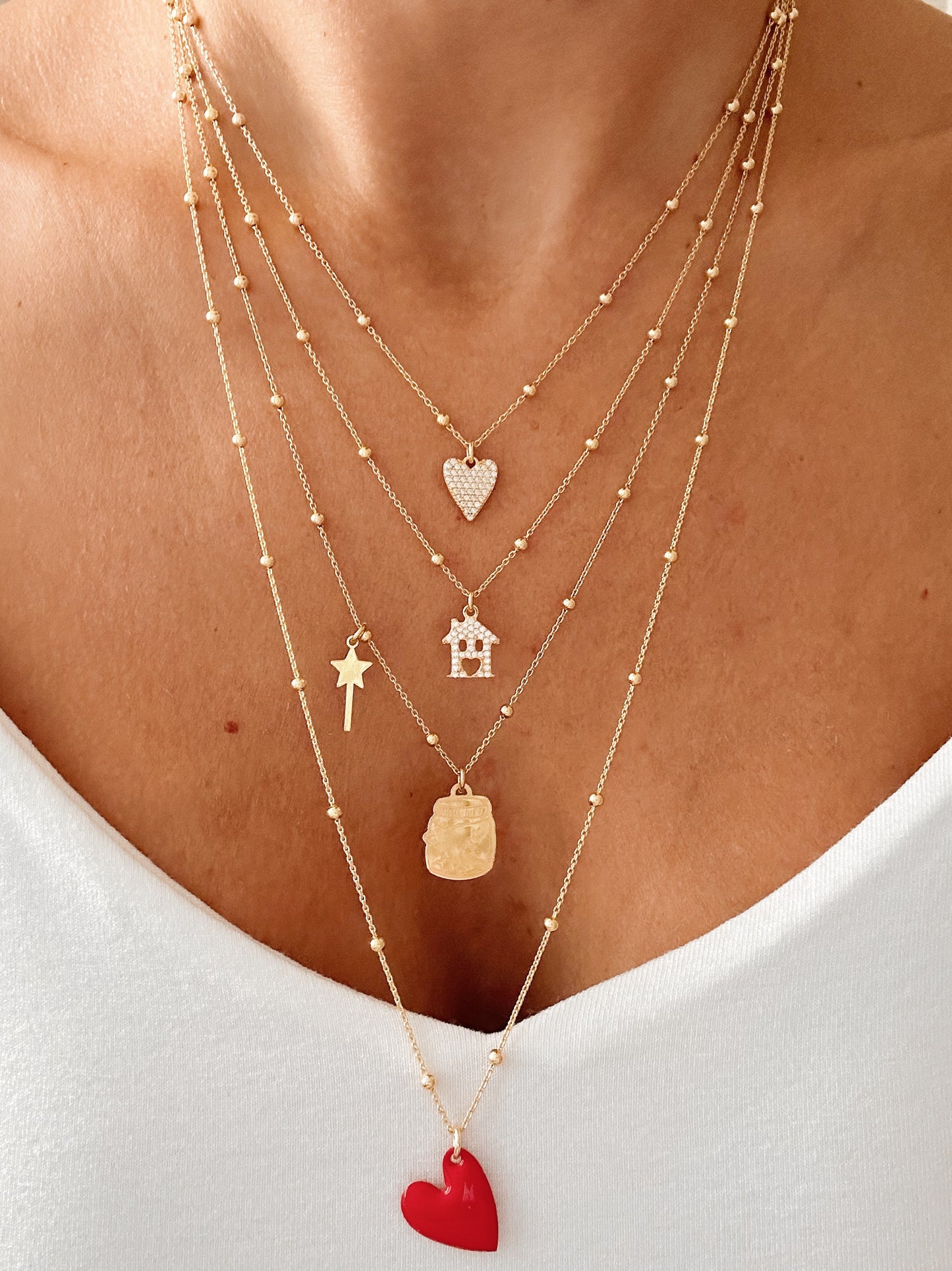 Collana con ciondolo mini cuore a punta e zirconi